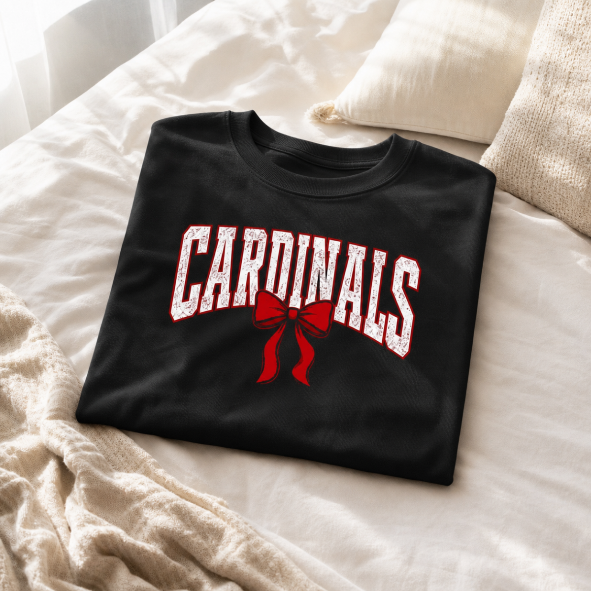 Black t-shirt with Cardinals graphic wearing a coquette bow